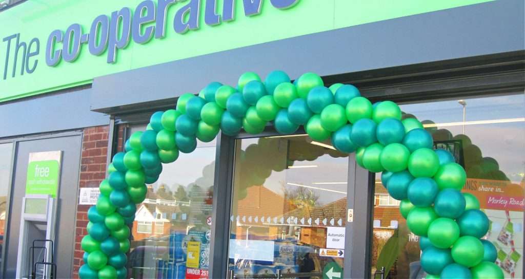 Promotional balloon arch at Co-op Store entrance