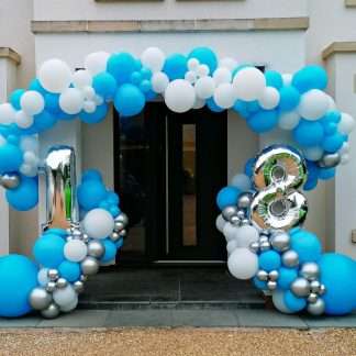 Building entrance decorated with organic balloon garland
