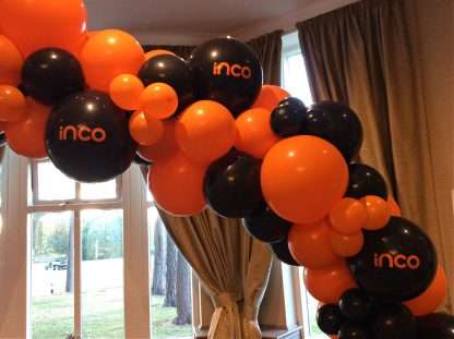 Balloon garland with company logo at The Belfry