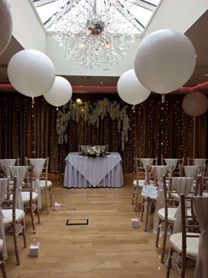 Large balloons with fairy light tails at Moddershall Oaks
