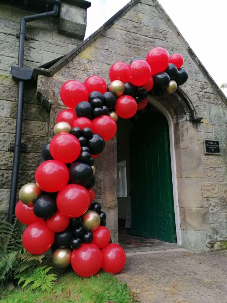Balloon half arch at entrance for birthday party