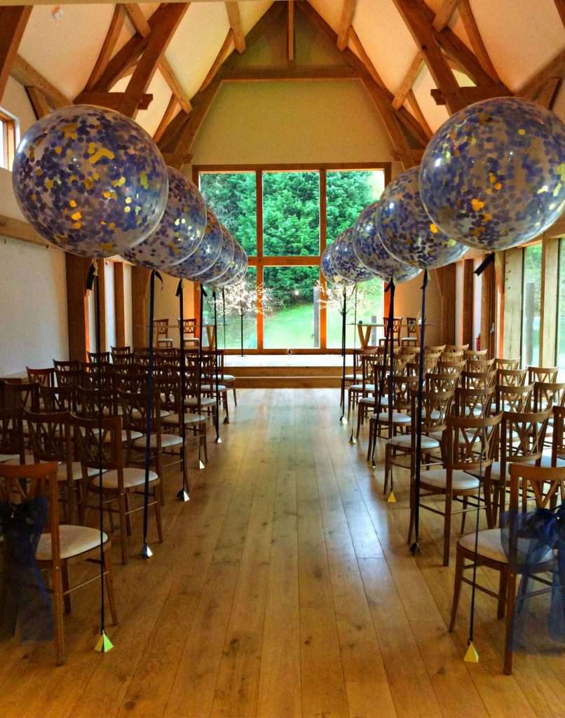 Giant confetti balloons for wedding ceremony at The Mill Barns