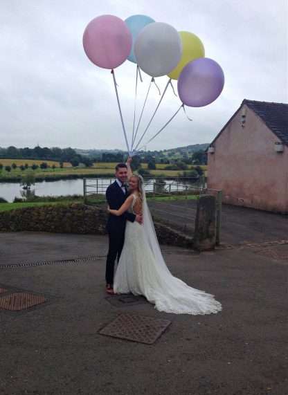 Wedding photo with balloons taken at The Ashes