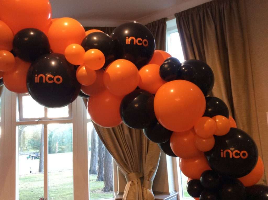 Customised balloon arch with company logo