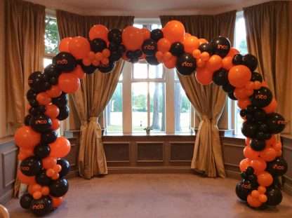 Balloon arch customised with company logo for event at The Belfry