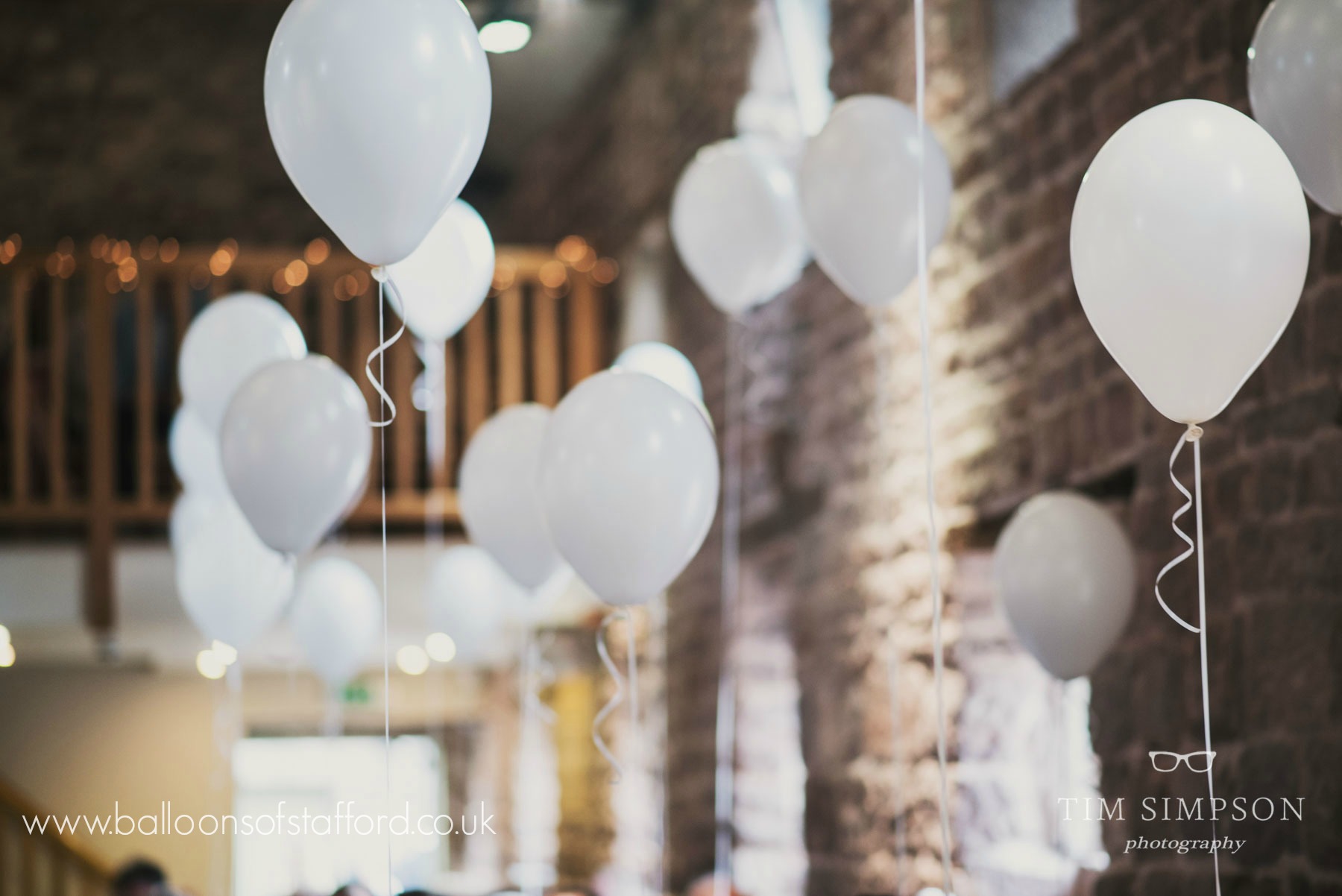 Helium filled white wedding balloons at The Ashes Wedding Venue